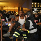 Justin Carr being carried from the scene by Charlotte, NC fire department responders.